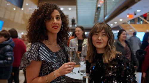 Audience members in the lobby